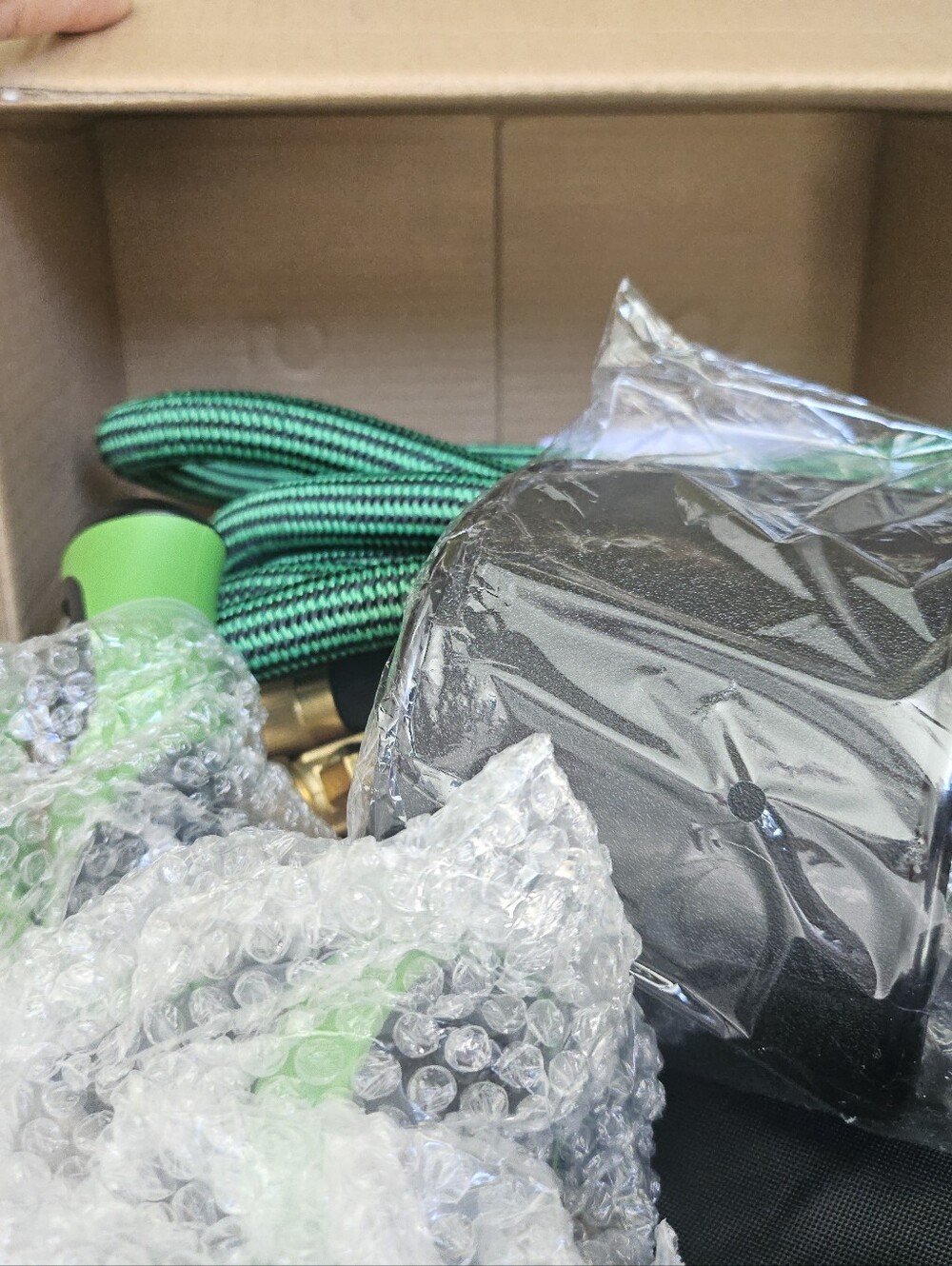 Green and Black Garden Hose Accessory Set